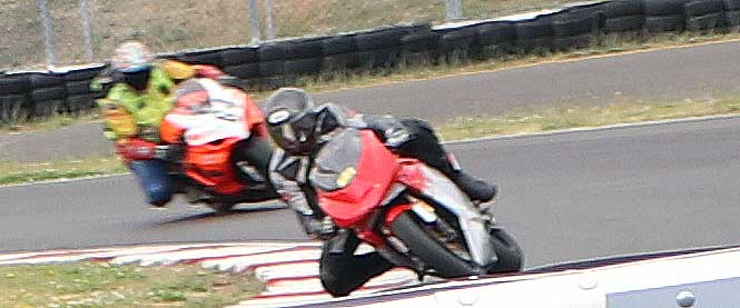 fast motorcycles on a turn pursuit from OregonMotorcycleAttorney.com Mike Colbach   sponsored PSSR track day at Portland International Raceway 7/18/16.