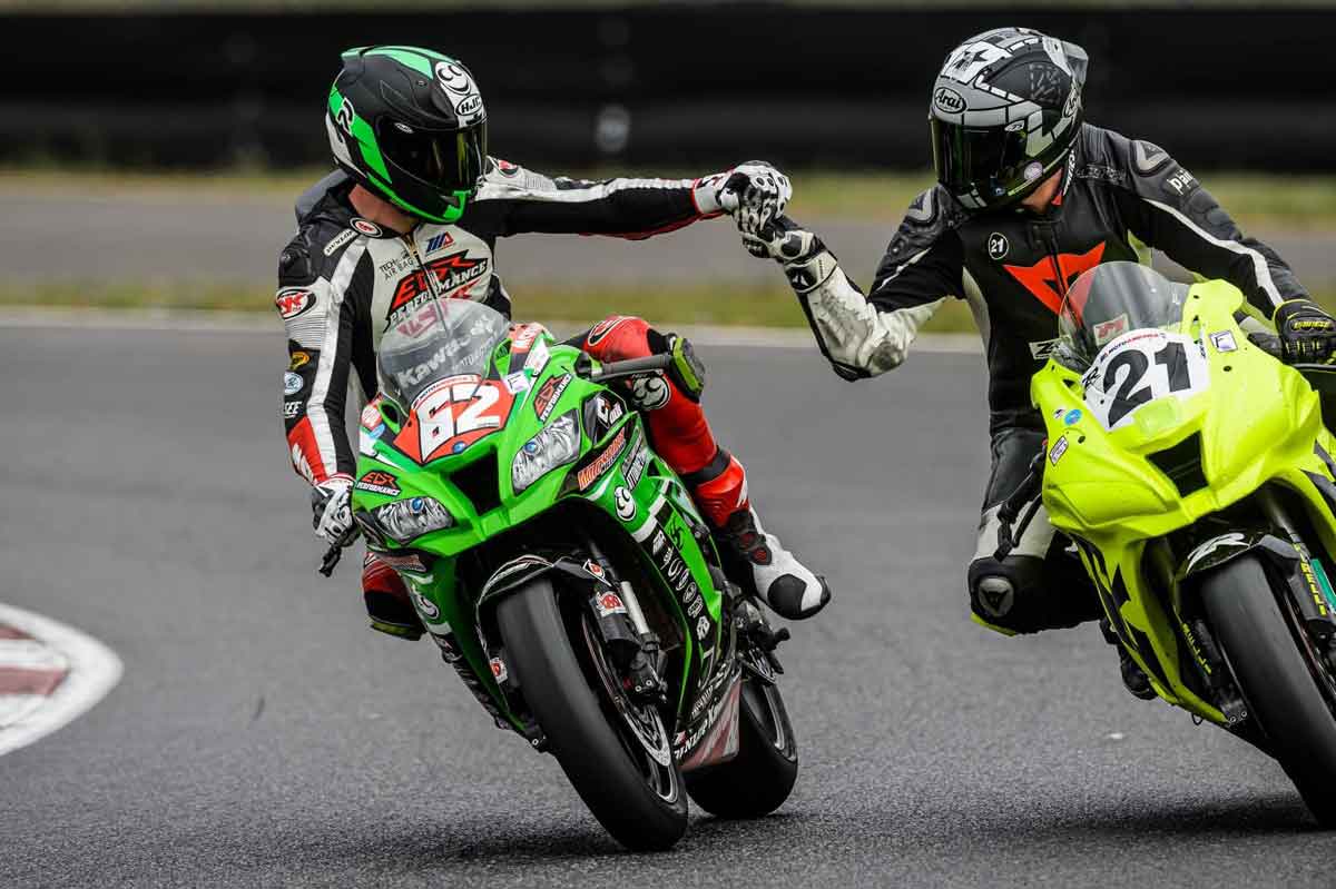 Andy DiBrino on his powerful EDR Performance 1000cc beast Kawasaki ZX-10R shakes hands with Kevin Pinkstaff also on a Kawasaki, after a close battle for the final Formula Ultra race at Portland International Raceway.