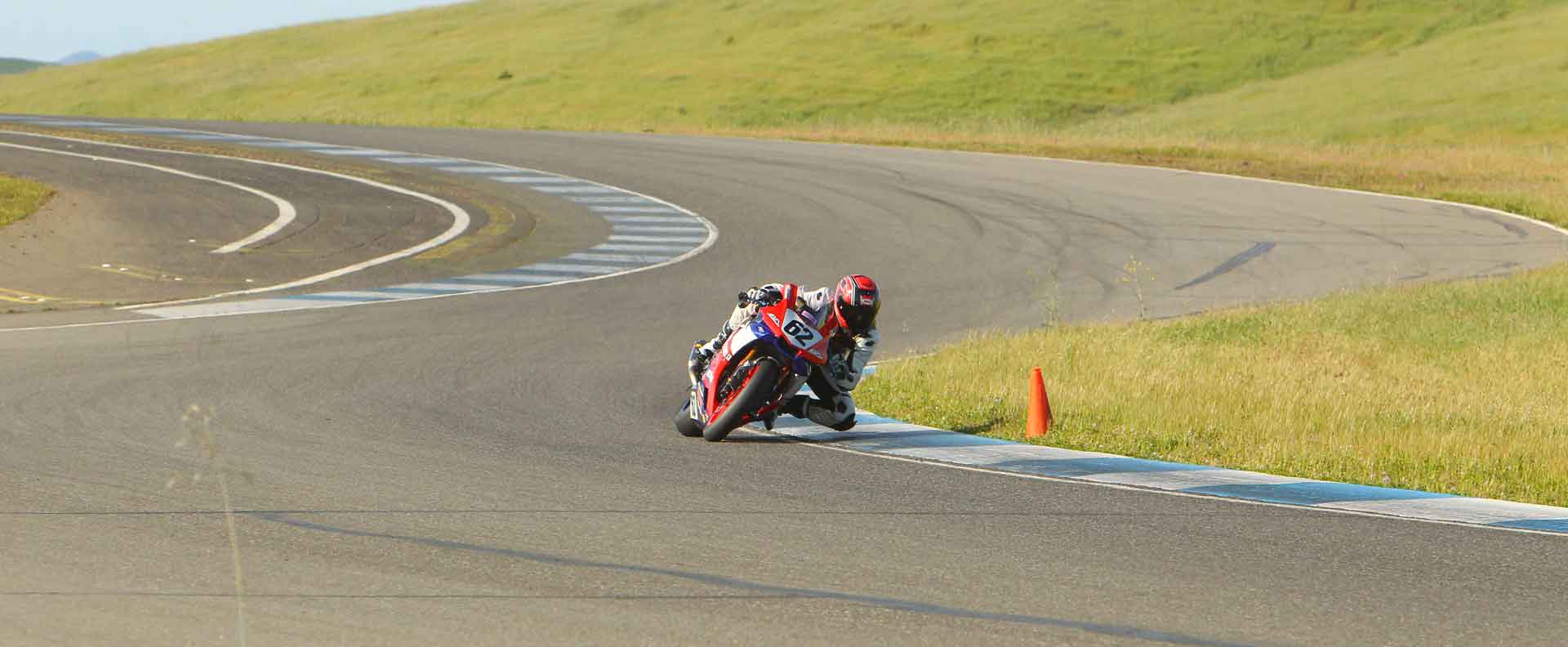 Andy riding through the curves at Thunderhill raceway on his R1 motorcycle backed by Oregon motorcycle attorney Mike Colbach