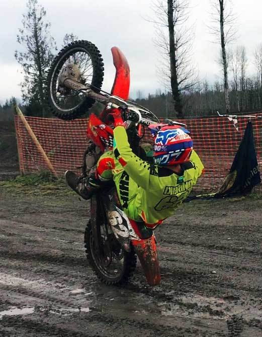 Andy DiBrino wheelie time on his MX motorcycle and a little Oregon mud