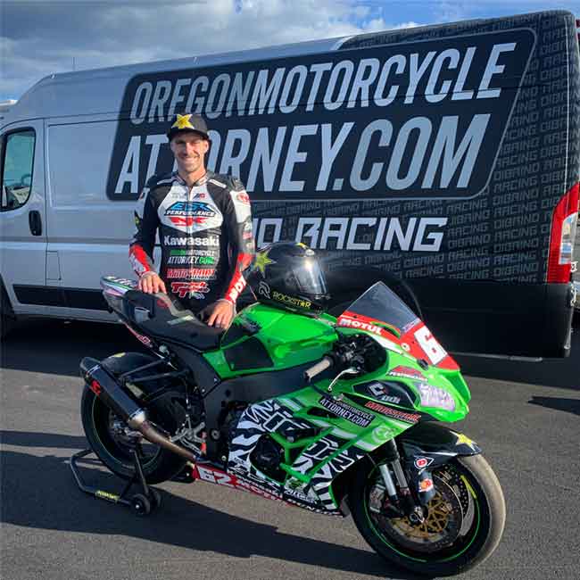 Andy in front of his Oregon Motorcycle Attorney sponsored van, with his stock 1000 kawasaki race motorcycle