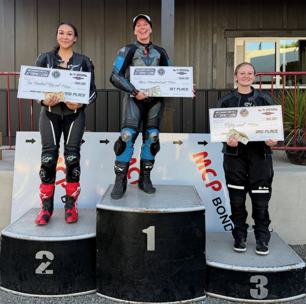 women motorcycle racers on podiums holding checks from sponsor Oregon Motorcycle Attorney  superpole laptime shootout prize money at Pat's Acres in Canby at Andy DiBrino Dept of Speed track day.