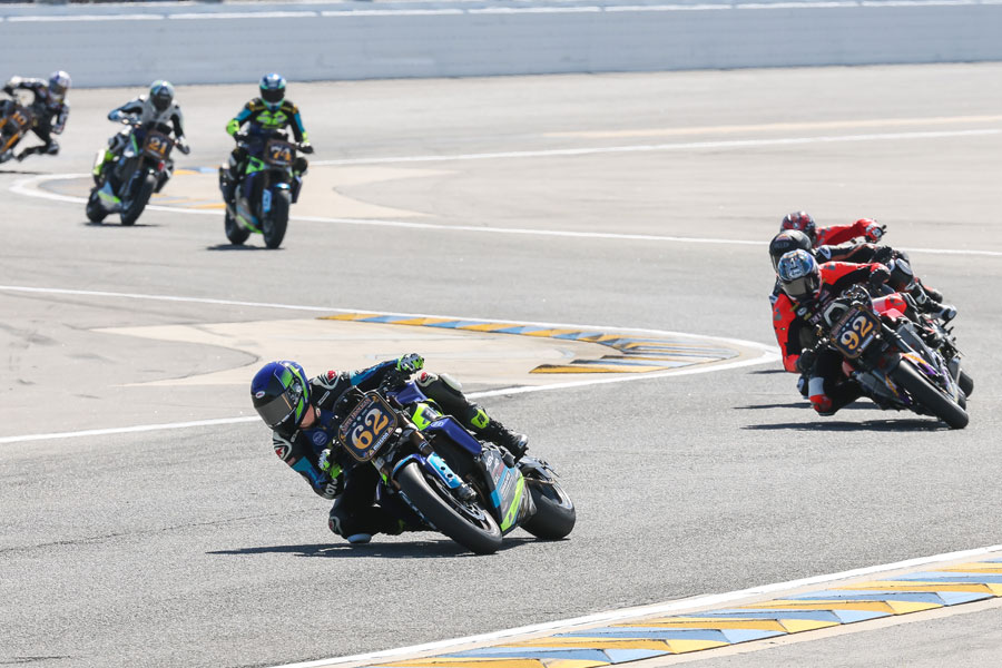 Andy DiBrino at the front of a 10 rider battle drafting and battling for the front working his way Daytona Super Hooligans