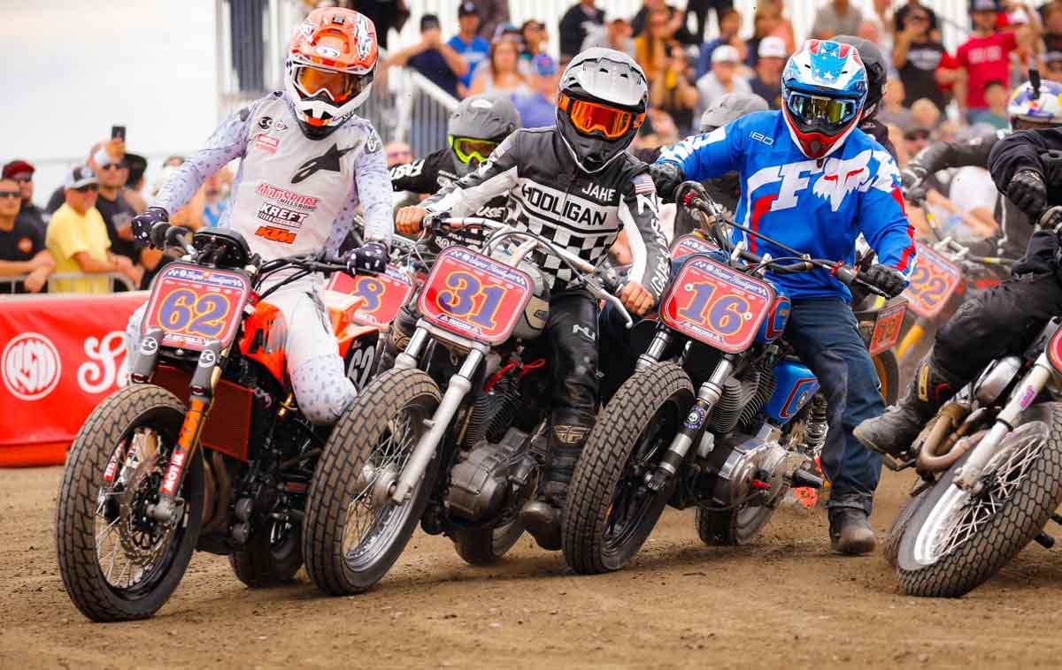 Andy DiBrino hops off his supercross 125cc motorcycle onto 400 pound super hooligan flat track monster at the start of the MotoBeach Classic race