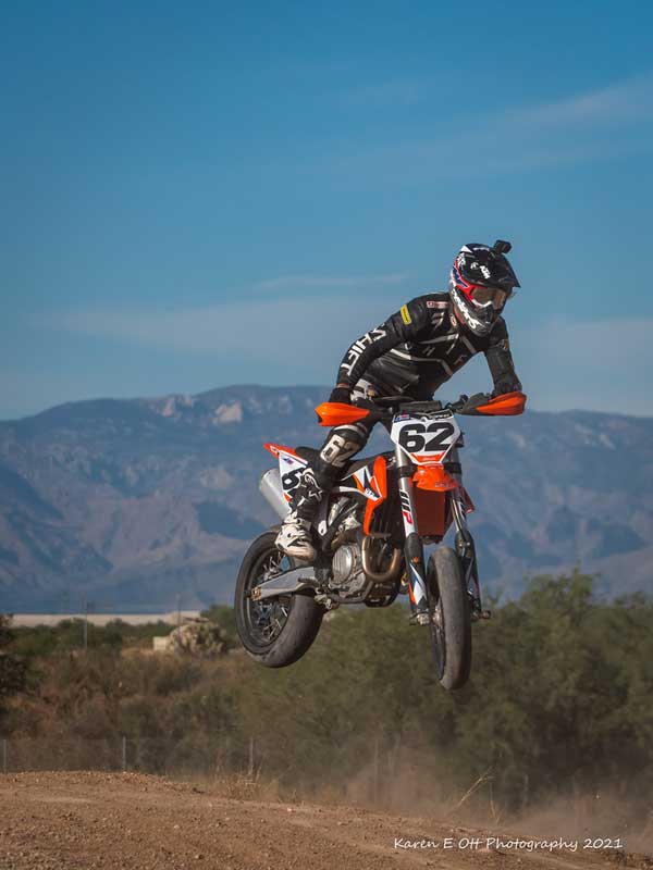 Andy DiBrino catching air on the KTM motorcycle