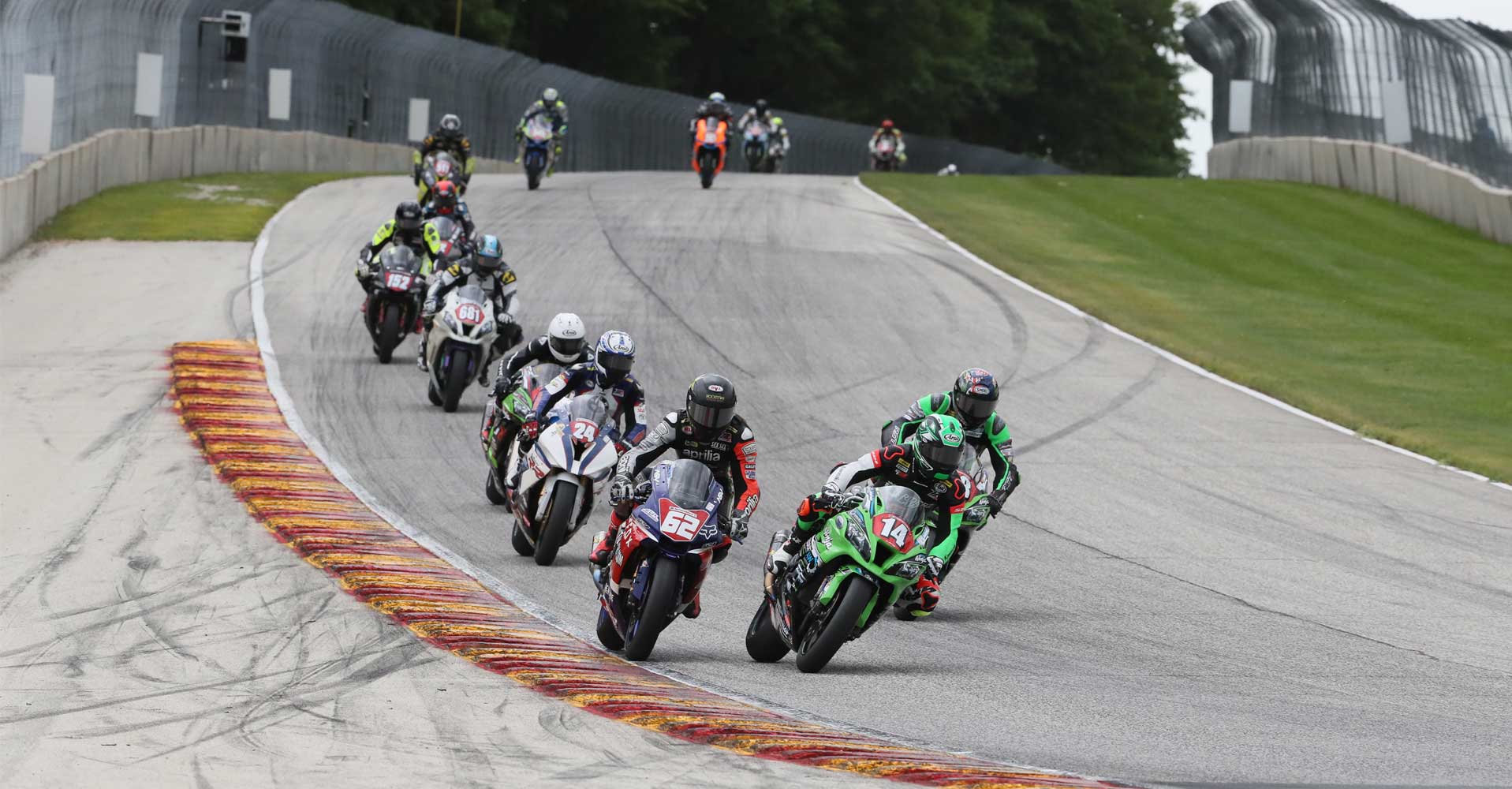 Andy DiBrino leading the pack ripping down the track MotoAmerica Wisconsin on his EDR Performance R1 - maybe a little wheelie but we'll have to ask Andy.