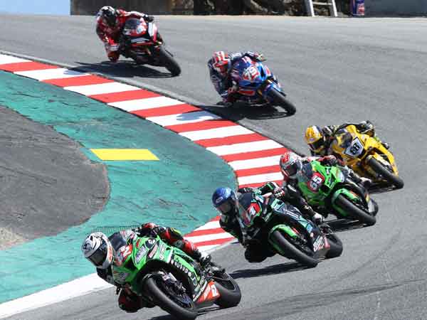 Oregon's own Andy DiBrino on his Kawasaki Oregon Motorcycle Attorney backed stock 1000 motorcycle at MotoAmerica Laguna Seca being hunted in a very competitive motorcycle rider group.