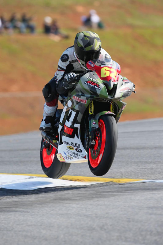 Andy DiBrino on his camo motorcycle at Road Atlanta MotoAmerica stock 600 race in 2015-2016 wheels up wheelie time